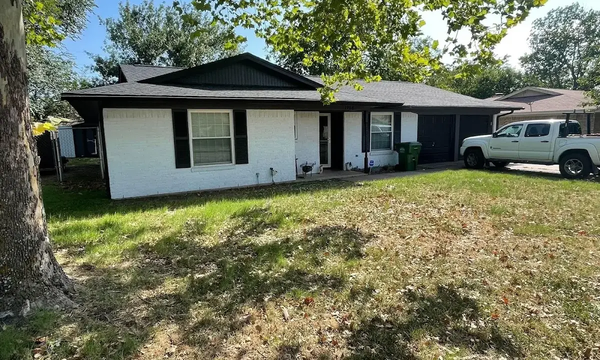Professional roofing crew working on a residential roof in Bel Air North